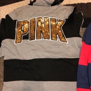 Two pink sweaters size small